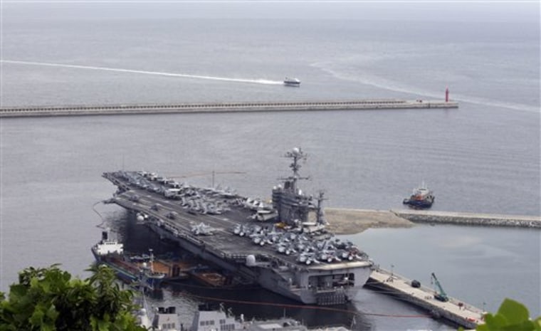 The U.S. nuclear-powered aircraft carrier USS George Washington drops anchor in Busan, south of Seoul, South Korea, on Saturday.